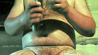 Russian gay pleasures himself with a cucumber in his rear