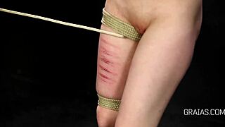 Punishing a blonde girl with a spanking paddle