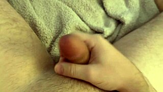 Gay jock shows off his morning hard cock in a solo video