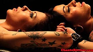 Lezdom mistress dominates bound submissives with fierce control