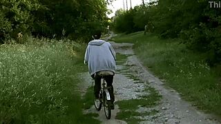 Young gay couple enjoys outdoor sex while cycling in summer