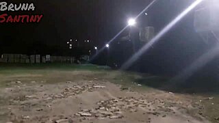 A brunette gives a blowjob in the parking lot of a high-end nightclub