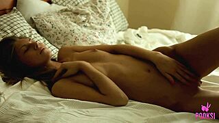 Tiny boobed teen Roxana plays with a vibrator in socks on her bed for solo fun