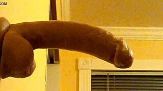 Gay man in hood has deep throat pleasure with a dildo