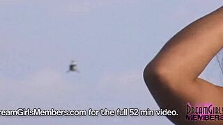 Outdoor topless beauty in a convertible on the Skyway bridge