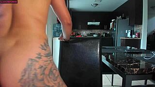 Girl passionately plays with a dildo and saliva on her tits
