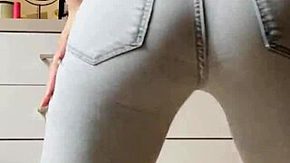 Petite blonde in tight jeans shows her cooleyhoppers in a homemade video