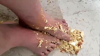 coolmarina tired from street, massaging feet with hard eggs on floor
