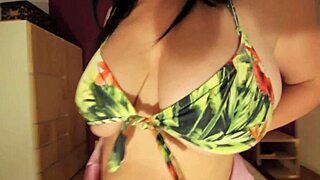 Busty amateur milf teases with bikini tops in bedroom