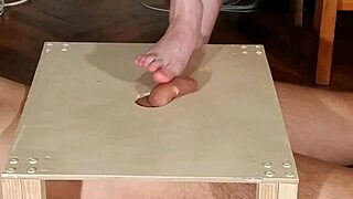 Hey, check out this domina stomping cock with bare feet and giving a wild footjob in HD.